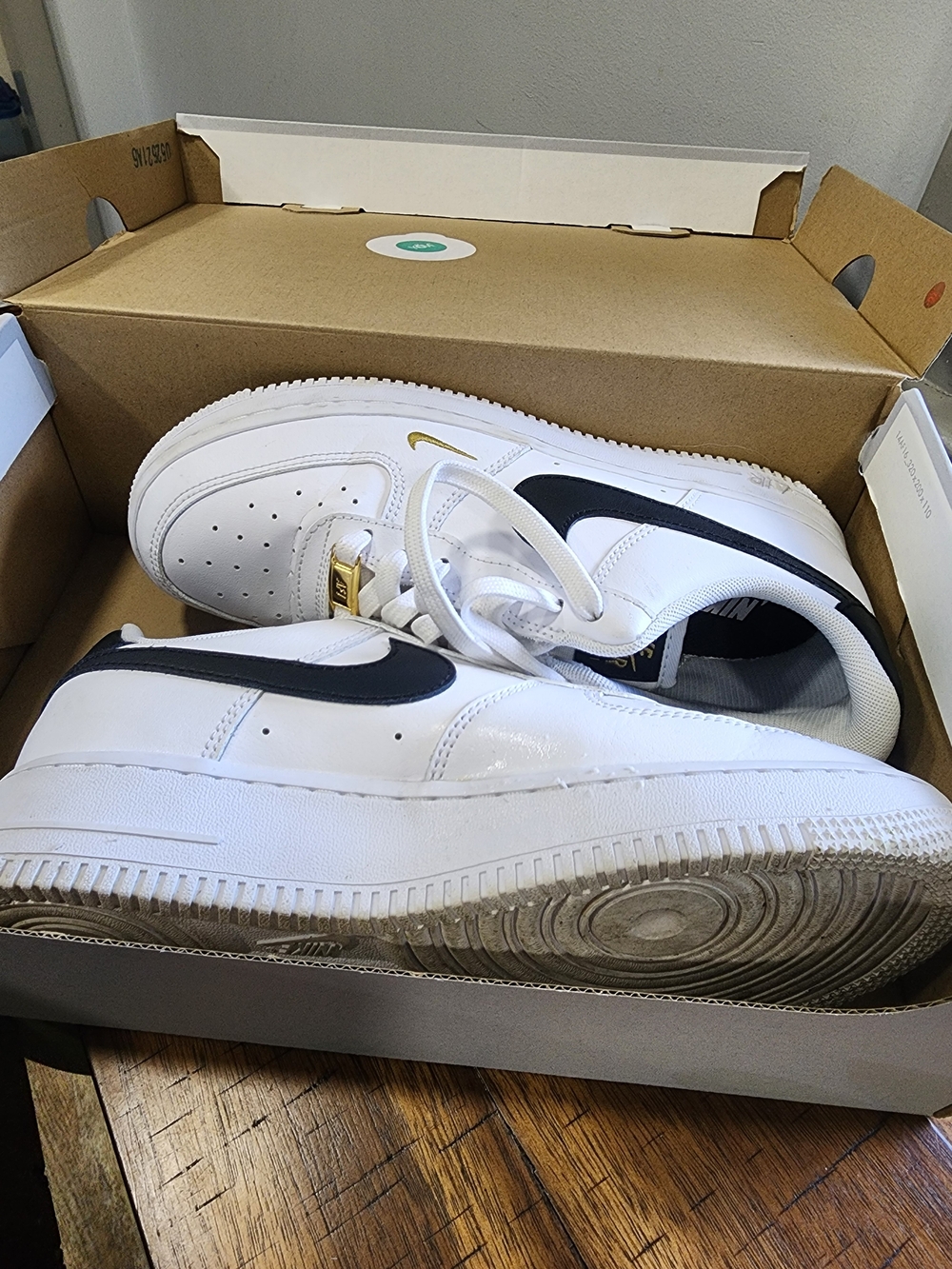 Nike Women's Air Force 1 with Black Swoosh and Gold Accent